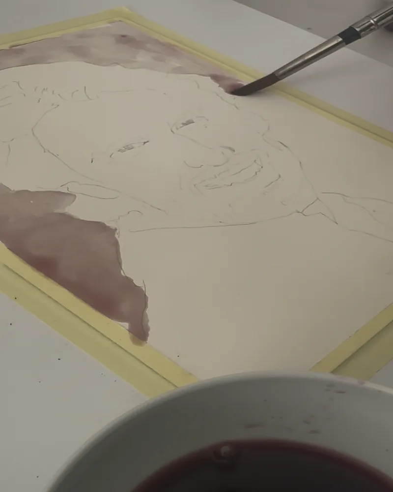 Early stage of a wine portrait, pencil sketch with first wine washes applied